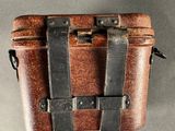 an old suitcase hanging from the ceiling on the wall