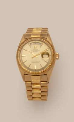 an image of a gold rolex watch on a white background