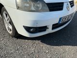 a picture of a white car parked on the side of the road