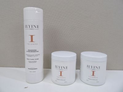 two bottles of lotion sitting on top of a counter next to a bottle of lotion