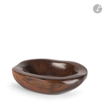 a wooden bowl with a handle on a white background