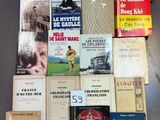 several books are stacked on top of each other on a table