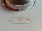 a close up of a silver and white device on a table