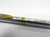 a close up of a pen on a table with a white background