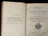 an open book with a picture of a coat of arms and a coat of arms on top of it