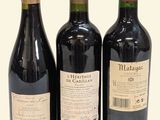 three bottles of wine sitting next to each other on a table
