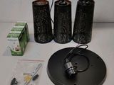 a table with a lamp, a candelab, and other items on it