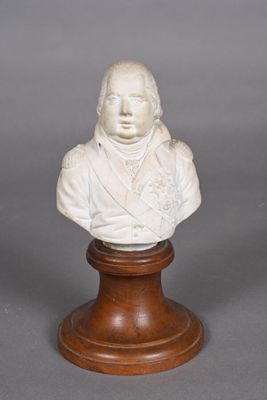 marble bust of a man on a wooden base