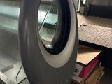 a glass display case with a tire on top of it
