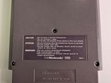 a close up of a nintendo game on a white surface