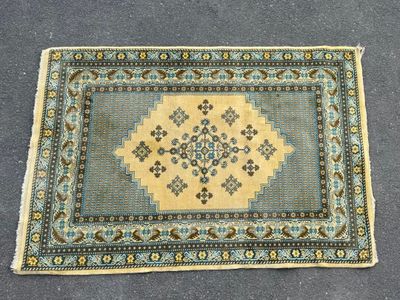 a rug with a blue and yellow design on it