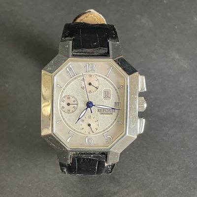 a close up of a wrist watch on a table