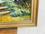 a picture of a painting on a easel on the ground