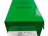 a green box that has a roll of toilet paper in it