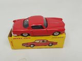 a red toy car sitting on top of a yellow box