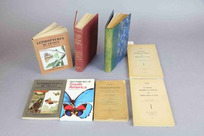 several books sitting on top of a table next to each other