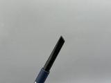 a pen that is sitting in a cup on a table