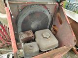 an old machine that is sitting on the ground