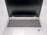 an open laptop computer sitting on top of a white table