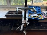 a picture of a workbench with tools on it in front of a window