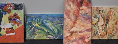 four paintings of different colors and sizes on the wall