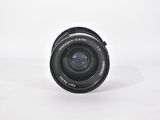 a close up of a camera lens on a white surface