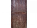 an old wooden cabinet with a door and a drawer on top