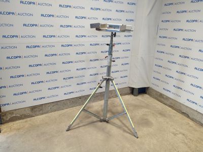 an image of a camera on a tripod in front of a wall
