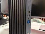 a desktop computer sitting on a desk in front of a monitor