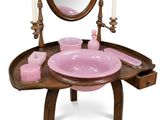 a vanity with a mirror, sink, and candles on it