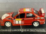 a red toy car in a clear case