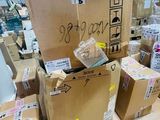 many boxes stacked on top of each other in a warehouse