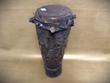 an image of a wooden vase on a brown background