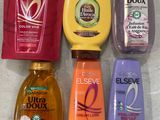 several bottles of body wash are lined up on a counter