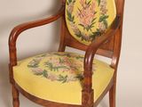 a wooden chair with a yellow seat and a yellow cushion