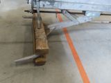 a boat that is sitting on a wooden stand