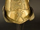 a gold helmet with a crown on top of it