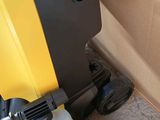 a yellow and black machine that is sitting on the floor