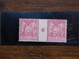 a close up of two stamps on a wooden surface