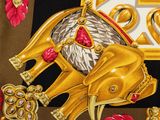 an image of a scarf with a gold elephant on it