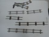 a lot of different types of train tracks on the table