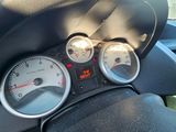 a close up of a car dashboard with a speedometer and gauges