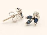 pair of sapphire and diamond stud earrings on white background