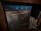 an image of a dishwasher in a dirty kitchen