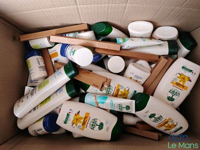 a box full of baby lotions and bottles of lotion