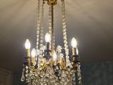 a chandelier hanging from the ceiling in a room