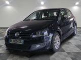 a picture of a black vw golf parked in a garage