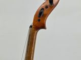 a close up of a violin on a stand with a white background