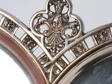 a silver plate with a crown on top of it