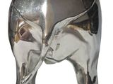 a shiny silver elephant statue on a white background